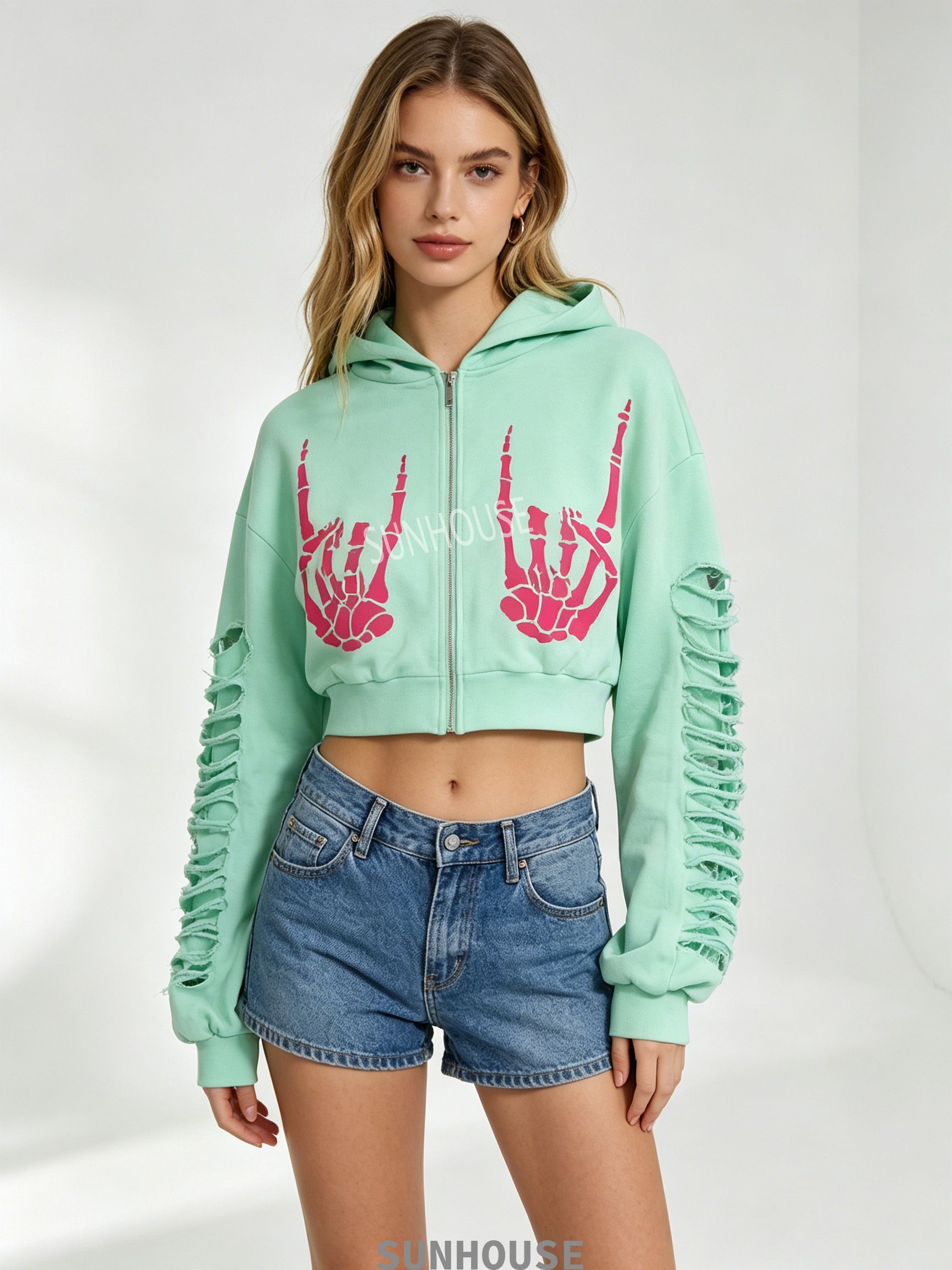 green hoodie with pink skull hand print